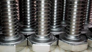Screw and bolt close-up. Construction hardware background. Bolts and nuts. video