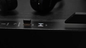 Top panel of a gaming computer with USB ports and indicators. Black pc tower case with usb connection sockets, power and reset buttons video