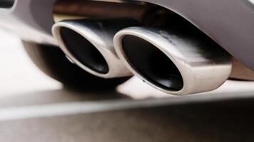 details of a car muffler during engine start. Close up of car exhaust pipe. video
