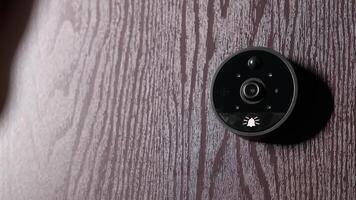 Close up of hand pressing the doorbell. Woman ringing intercom with camera in entryway. video