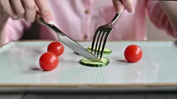 Diet problems, eating disorder - woman eating small portion of salad on plate. video