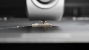 A 3D printing machine prints a technical product from plastic. Working modern 3D printer head. video