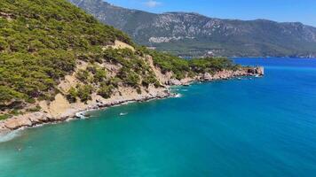 Antalya Turkey 10.25.2024. Aerial view of turquoise bay with cliffs and swimmers video