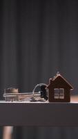 vertical House shaped keychain and keys resting on table symbolizing new home purchase video