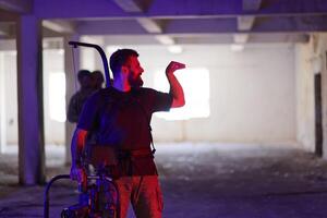 A professional cameraman captures the intense moments as a group of skilled soldiers embarks on a dangerous mission inside an abandoned building, their actions filled with suspense and bravery photo