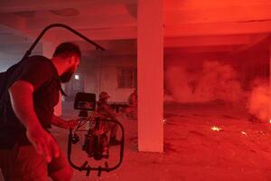 A professional cameraman captures the intense moments as a group of skilled soldiers embarks on a dangerous mission inside an abandoned building, their actions filled with suspense and bravery photo