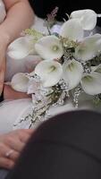 A close-up view of a bridal bouquet featuring beautiful white flowers video