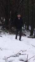 Man Hiking in Snowy Forest video
