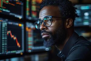 Stock market analyst trading online looking at charts and data for investment strategy analysis photo