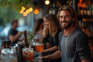 Handsome man smiling at a bar with drinks and friends enjoying the evening happy hour scene vibe photo
