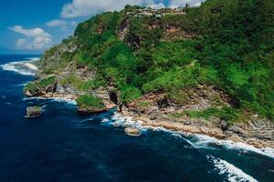 Scenic landscape with rocks, hight cliff on coastline with blue ocean. Aerial view photo