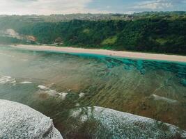 Coastline with cliffs and ocean in Bali. Aerial view of Pandawa photo