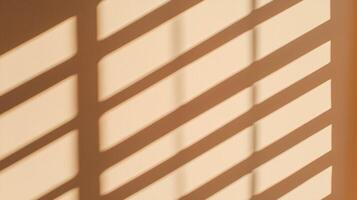 Diagonal window shadows cast on a beige wall. The geometric pattern created by the sunlight gives a minimalistic and modern aesthetic, emphasizing light, structure, and simplicity. photo