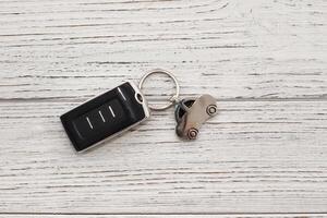 car key remote control on a wooden background photo