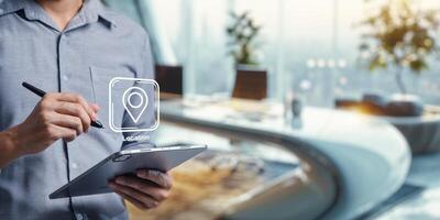 Businessman Using Tablet with Location Icon for Navigation Purpose photo