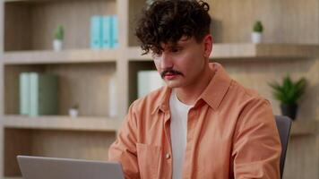 Caucasian business man freelancer student office worker manager entrepreneur employer working laptop email typing businessman browsing computer online studying looking at camera nod head approve sign video
