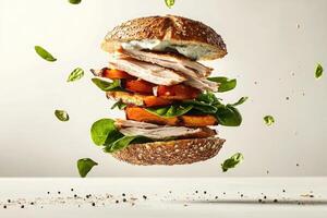 Mega sandwich with vibrant ingredients gracefully floating in mid-air against a bright background photo