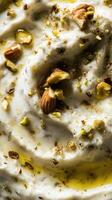 Gorgonzola cheese dip with toasted walnuts and crushed pistachios in a serene setting photo