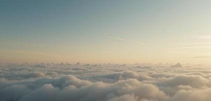 A scenic view of fluffy clouds stretching out to the horizon under a blue and yellow sky photo