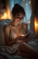 Beautiful woman reading online message on phone in moonlit room photo