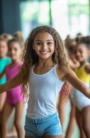 A little girl in a dance class with other children photo