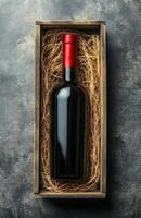 A bottle of red wine in a wooden box photo