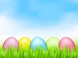 Colored easter eggs in grass vector