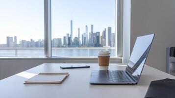 Laptop on desk with city view photo