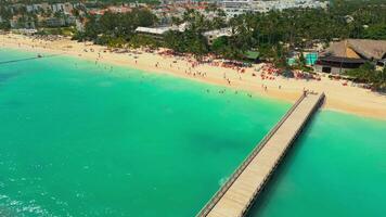 Flight over an all-inclusive hotel beach on a bright sunny day in Punta Cana video