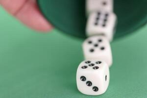 Excitement builds as dice tumble from a cup during a game in a c photo
