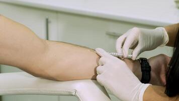 Close-up vaccination procedure. Injection in to hand. video