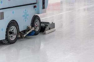 Ice resurfacing machine cleaning ice rink surface in Vienna photo