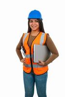 vertical Confident latin architect woman holding laptop and walkie-talkie photo