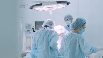 A surgeon in a sterile operating room performing a surgical procedure with focus and precision. Represents healthcare, surgery, medical expertise, and patient care 10 video