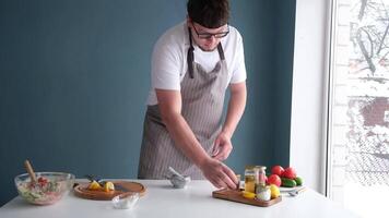 man making seasoning in the mortar , adding salt and pepper video