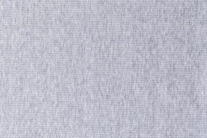 Light gray heather fabric texture as a background, showcasing the intricate detail of the weaving pattern, suitable for textile and design projects photo