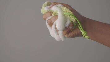 Hand scrubbing with soap and loofah for effective cleansing video