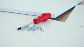 Building furniture with screwdriver and screws in workshop video