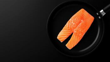 Salmon slice fresh un cook on black frying pan photo