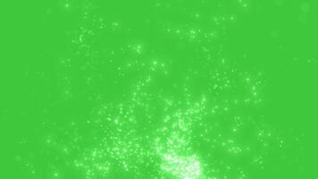Abstract background with particle trail. Particles swirl and fly. Glitter background. Magic pollen and beautiful bokeh on green background. Background for celebrations and awards video