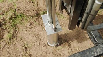 Soil examination of agronomy. Geotechnical investigation. Collecting black soil on the field for examination and analysis. Special equipment for pickup 9 video