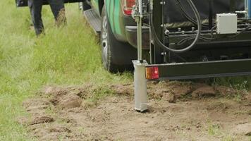 Soil examination of agronomy. Geotechnical investigation. Collecting black soil on the field for examination and analysis. Special equipment for pickup 4 video