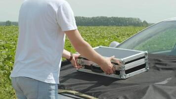 Laboratory assistant conducting research on plants in the field video