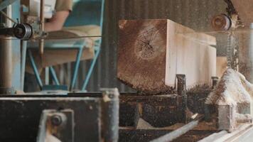 Sawing machine at wood production factory. Timber material processing and cutting at sawmill. Manufacturing process at lumber mill. Automatic Circular Sawing Machine 11 video
