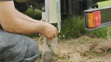 Man putting black soil into pack. Soil examination of agronomy. Geotechnical investigation. Collecting black soil on the field for examination and analysis. Special equipment for pickup 2 video