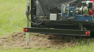 Soil examination of agronomy. Geotechnical investigation. Collecting black soil on the field for examination and analysis. Special equipment for pickup 11 video