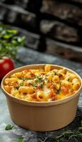 Delicious mac and cheese macaroni pasta baked on brown paper bowl story background photo