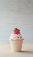 Strawberry ice cream with strawberry fruit topping and brown paper cup vertical background photo