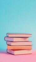A stack book literature knowledge student on blue vertical background photo