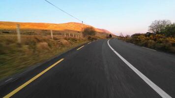 Driving fast on scenic road with mountains and lakes, wild Atlantic way hyper lapse, Connemara national park, Galway, Ireland video